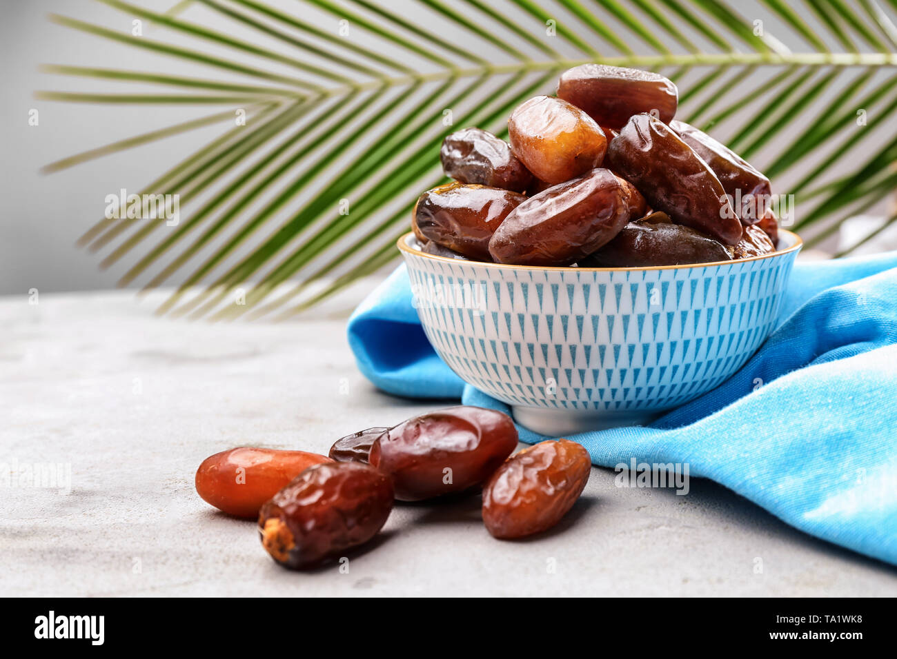 Bowl with sweet dried dates on table Stock Photo - Alamy
