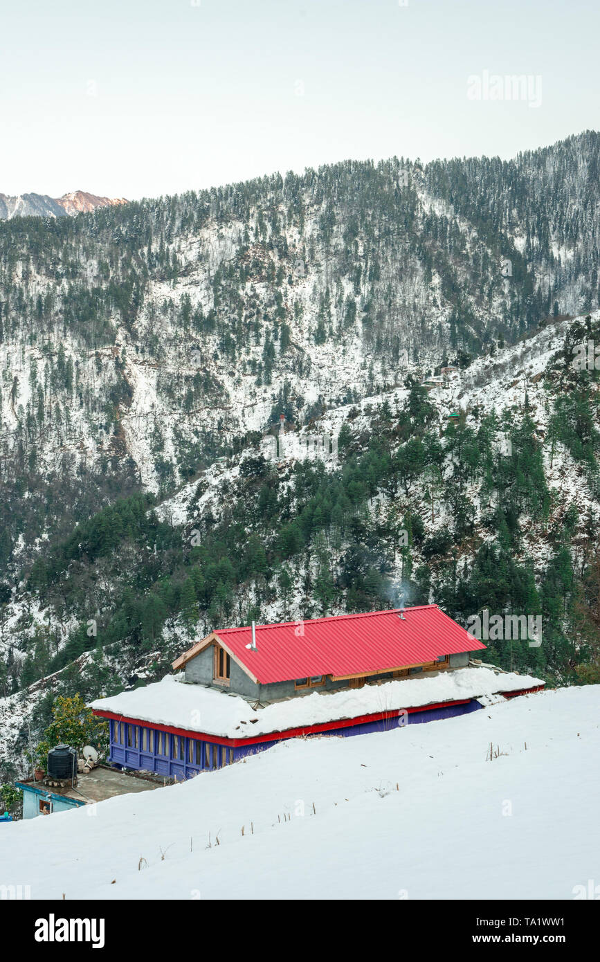 Snow covered wooden house in mountains - Majestic winter landscape in ...