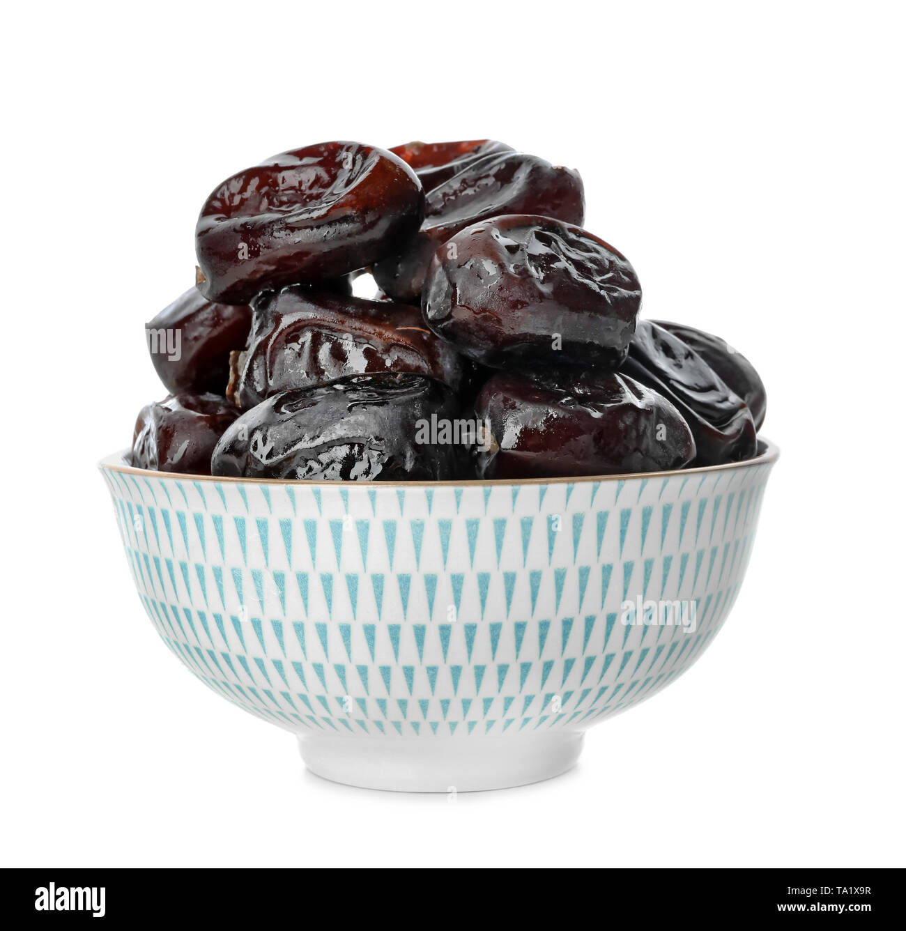Bowl with sweet dried dates on white background Stock Photo - Alamy