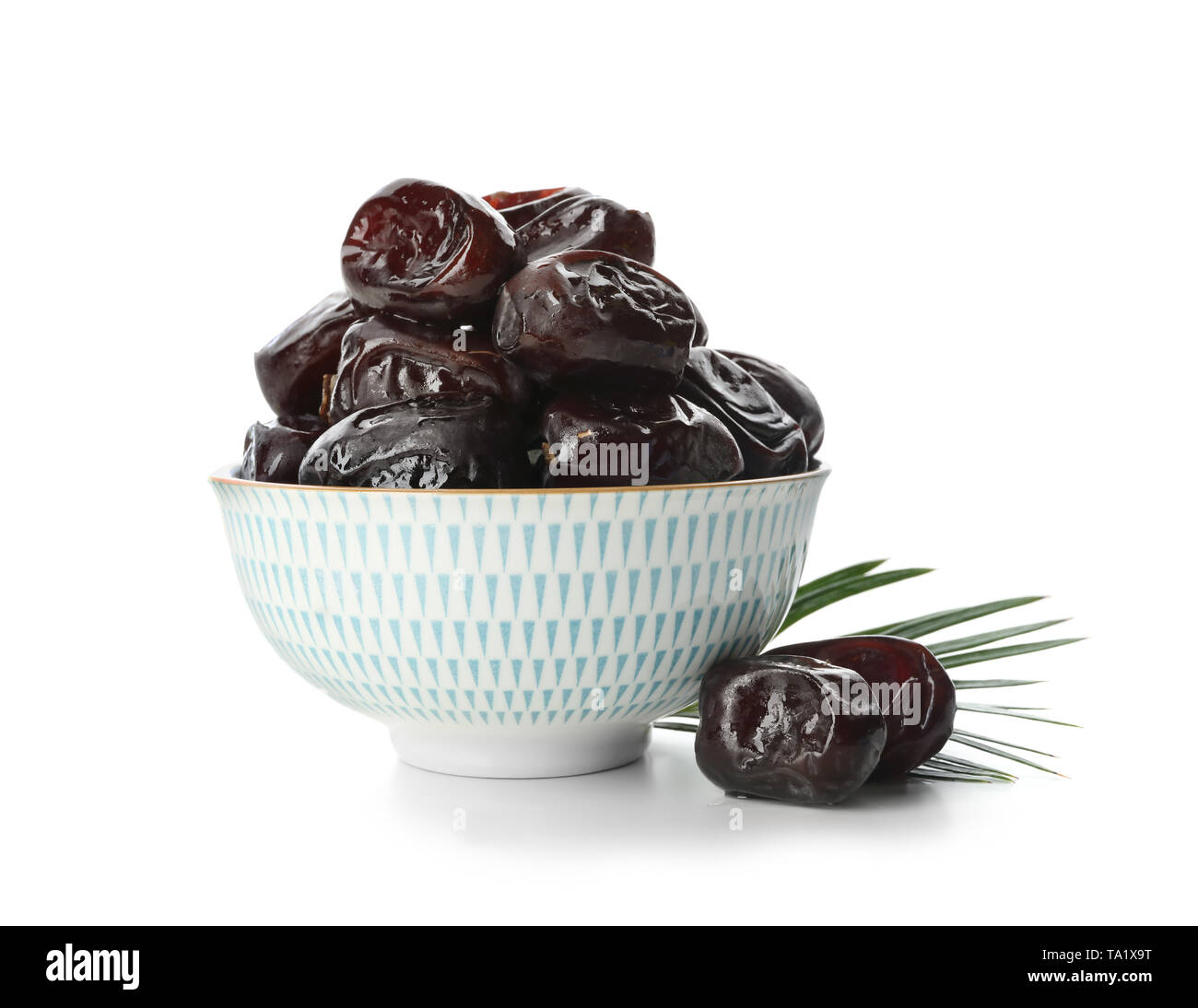 Bowl with sweet dried dates on white background Stock Photo - Alamy