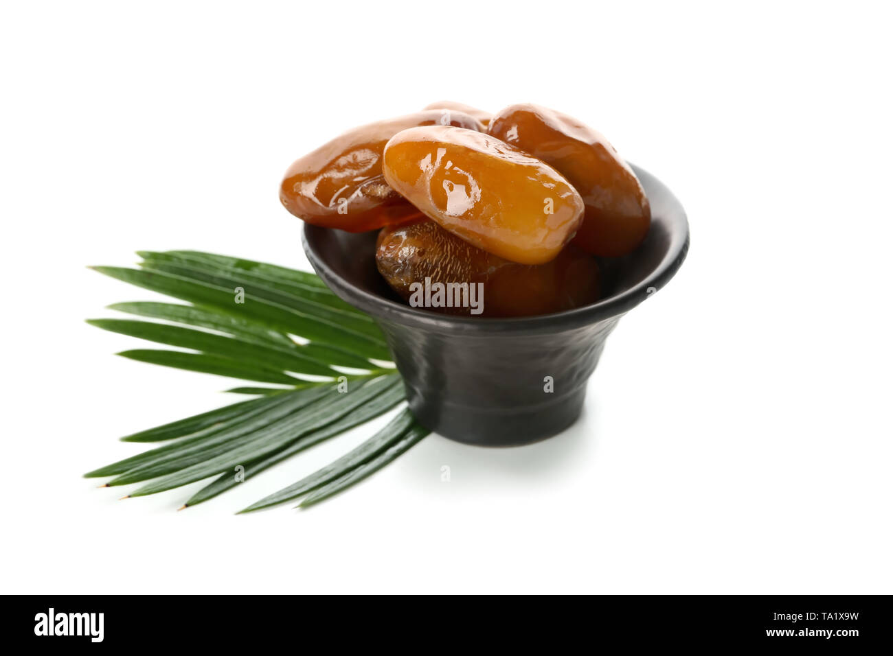 Bowl with sweet dried dates on white background Stock Photo - Alamy