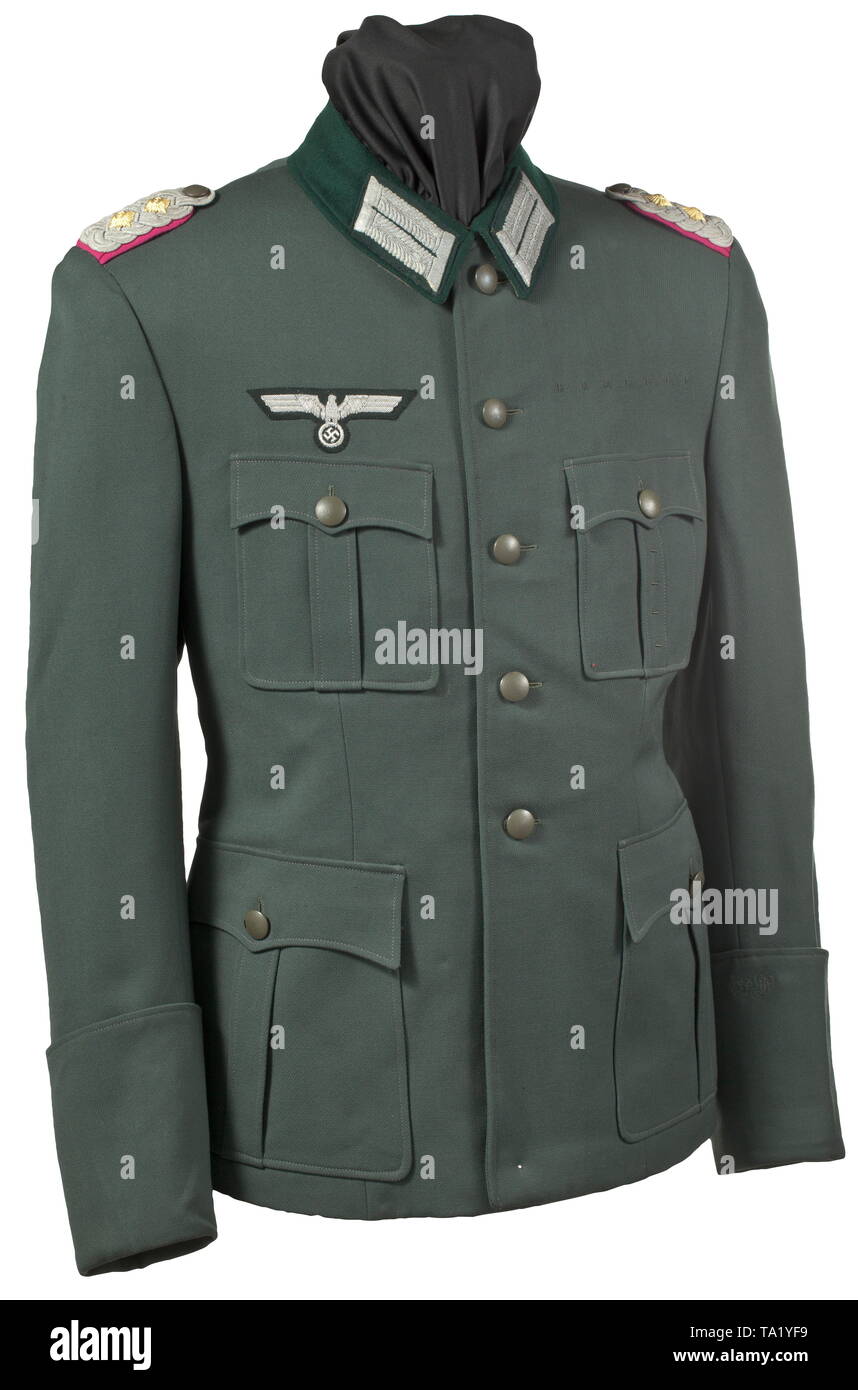A tunic for an Oberst on the general staff made to measure by Choque, Paris Green gabardine with dark green collars, field-grey buttons and dark green silk liner with hanger and opening for the officer's dagger. Silver-embroidered eagle on a dark green base, dark green collar tabs with silver lobe embroidery, sewn-on shoulder boards with matte braid, orders loops. historic, historical, army, armies, armed forces, military, militaria, object, objects, stills, clipping, clippings, cut out, cut-out, cut-outs, 20th century, Editorial-Use-Only Stock Photo