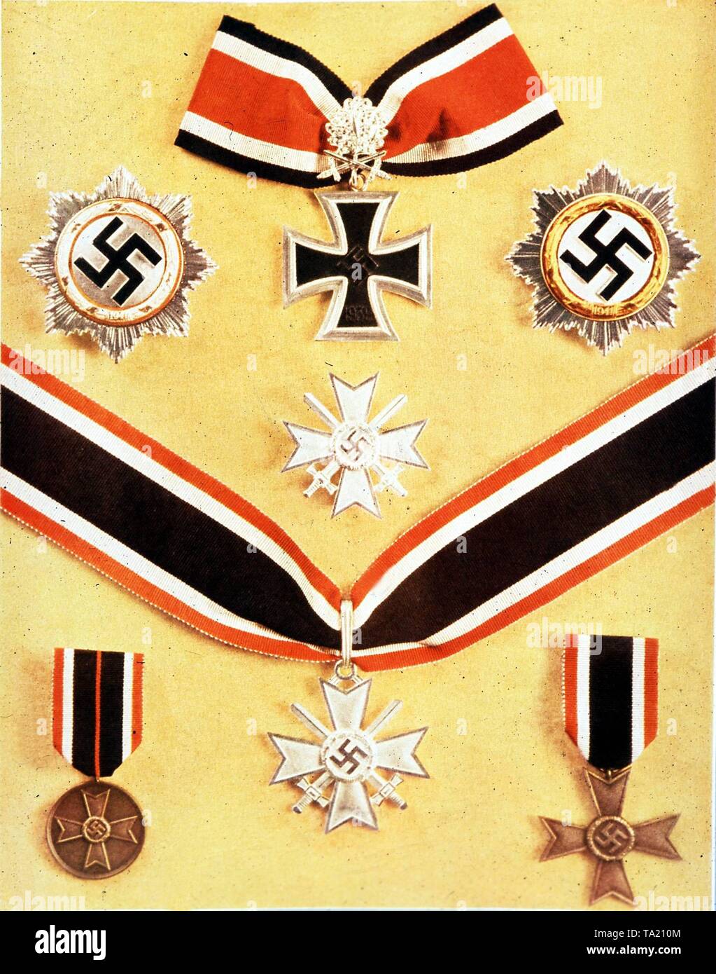 German medals from the period 1939-1945. Above the Knight's Cross of the Iron Cross with Oak Leaves, Swords and Diamonds, left the Silver at right the Gold German Cross. Bottom row, the War Merit Cross and the Knight's Cross of the War Merit Cross. At the bottom left and right unknown medals. Stock Photo