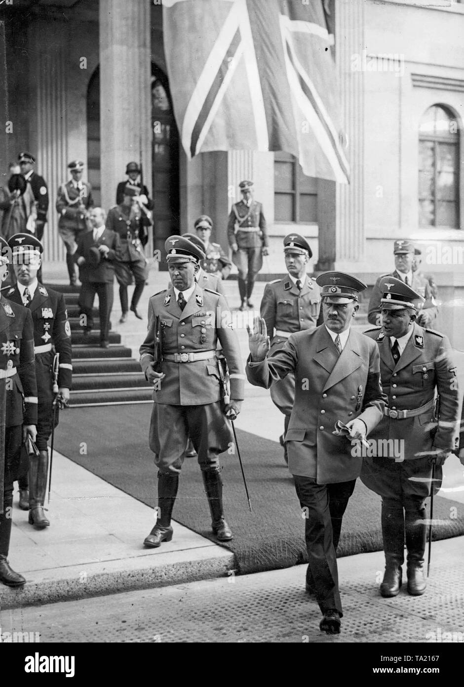 The Nazi leader with Martin Bormann, who became one of the most influential Nazi officials, here at the Munich Conference before the Fuehrerbau (Koeniglicher Platz) in September 1938. Left adjutant Julius Schaub, far left Karl Wolff. Stock Photo