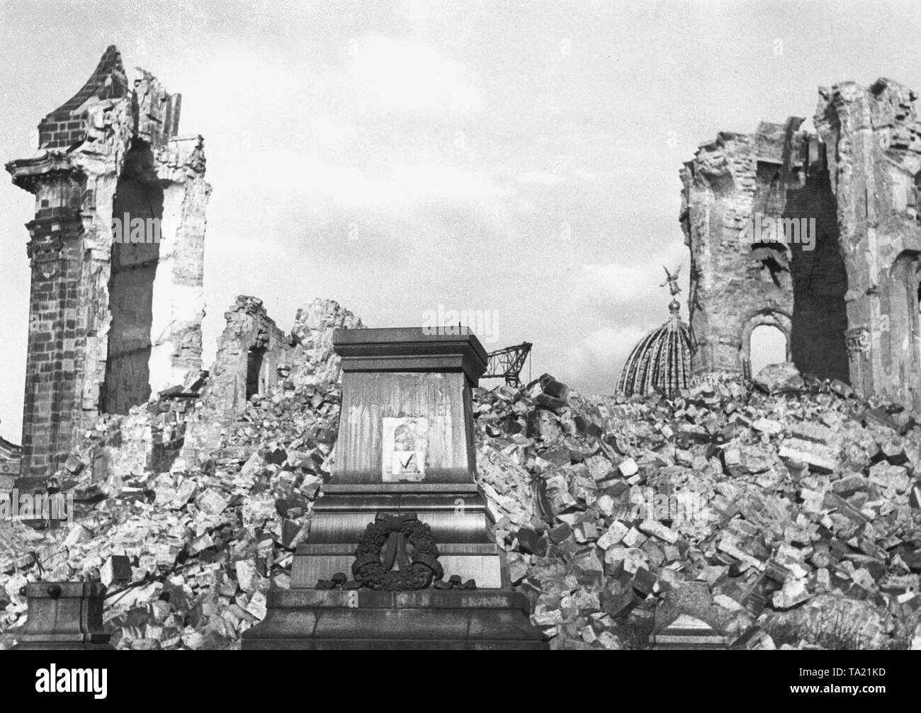 Destruction at the Dresden Neumarkt after Allied air attacks: On the site of the Frauenkirche there are only rubble and wall remains. On the monument base stood a statue of Martin Luther. Right in the background you can see the dome of the partially destroyed Arts Academy. Stock Photo