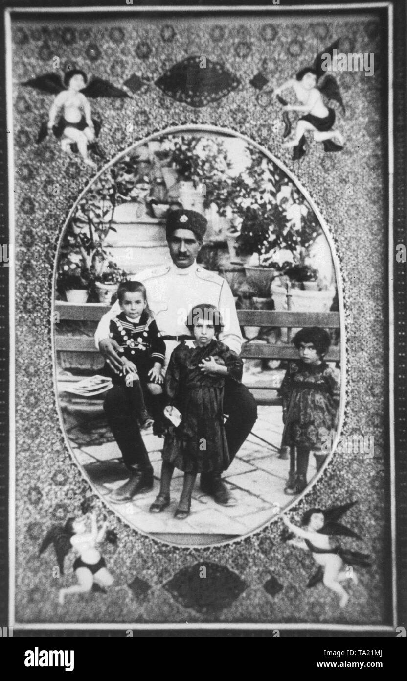 The Cossack colonel and later Shah of Iran, Reza Pahlavi with his three children, the heir to the throne and later Shah of Persia Mohammad Reza Pahlavi, Princess Ashraf and Princess Sham (from left to right). Stock Photo