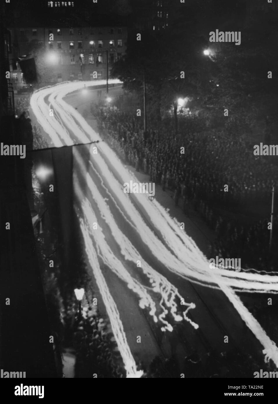 A torchlight procession is held in front of the Town Hall in Friedrichstrasse (today Friedrichswall) during the Reich leadership meeting of the Stahlhelm in Hanover. Stock Photo