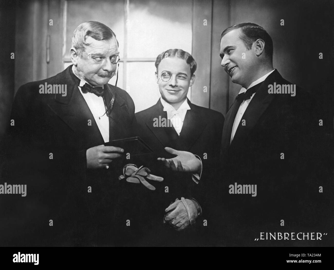 Ralph Arthur Roberts as Dumontier (left), Heinz Ruehmann as Serigny and Oskar Sima as servant Amadee (right) in the film 'Burglars'. Stock Photo