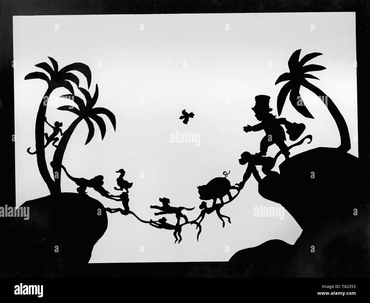 This photo shows a scene from the silhouette film 'Dr. Dolittle and His Animals' - subtitle: 'The Bridge of Apes' by Charlotte Reiniger. The silhouette film, also known as silhouette animation, is a technique of animated film in which silhouettes are put together on a lighted glass plate in front of a white or black background to form a film. The result is the silhouette film, inspired by shadow theater and the pictorial techniques of silhouette cutting. Stock Photo