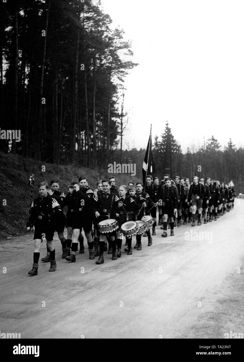 Pimpfs are marching in line with music along a forest path Stock Photo Alamy