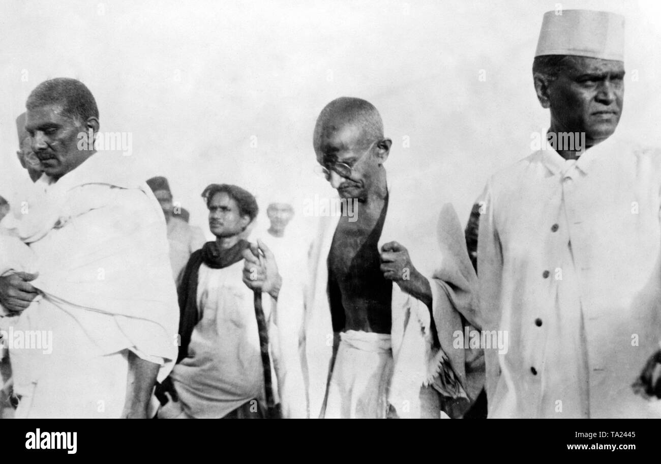 Mahatma Gandhi (center) and Manilal Kothari (left) on the Salt marsh