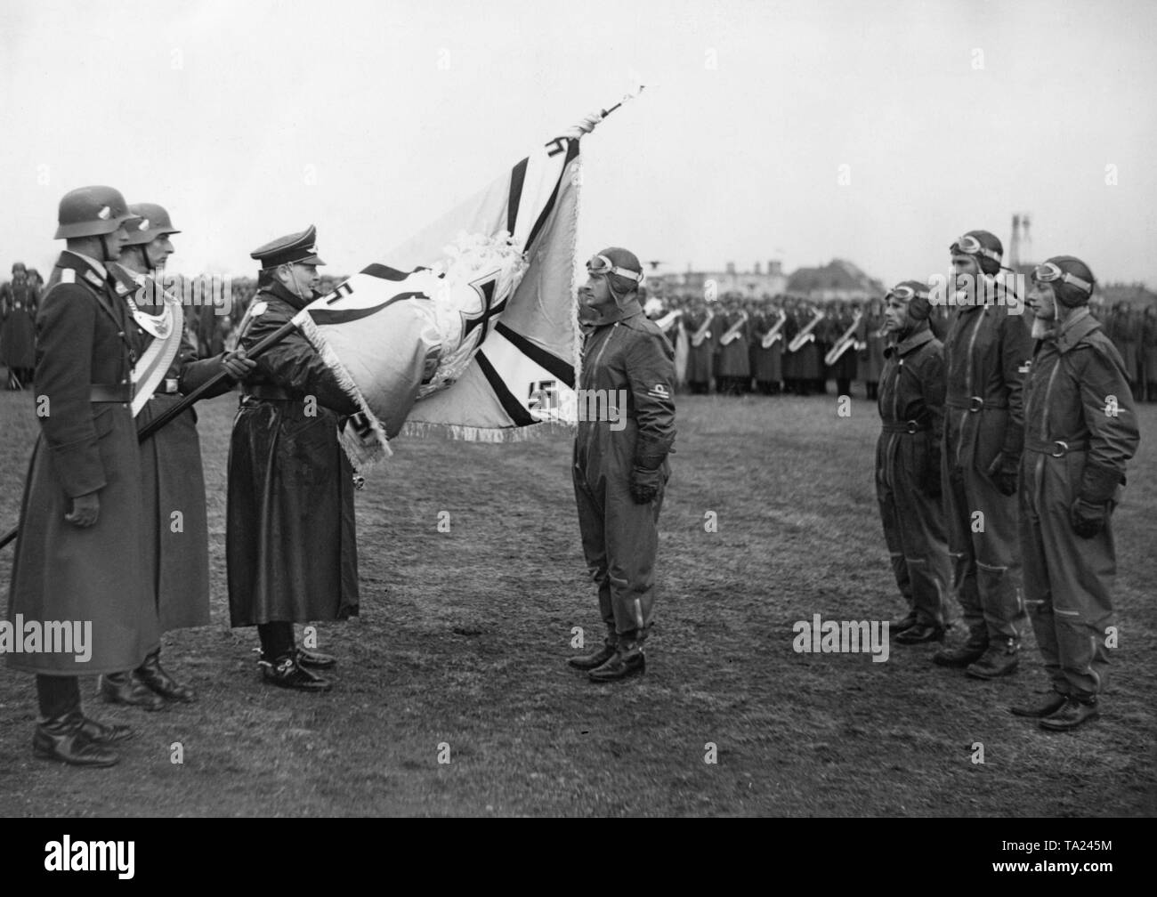Reich Minister Hermann Goering hands over a new troop flag to an Austrian fighter group. Stock Photo