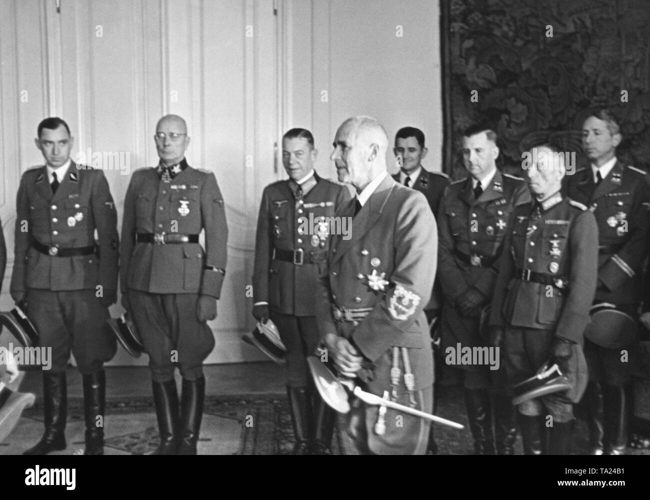 The Reich Protector of Bohemia and Moravia, Wilhelm Frick, receives members of the Wehrmacht and NSDAP in Prague. After the assassination of Reinhard Heydrich, Frick  becomes Reich Protector in 1943. Stock Photo