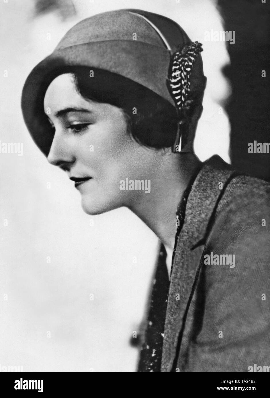 Portrait of a woman wearing hat with feather from the 1930s. Undated photo. Stock Photo