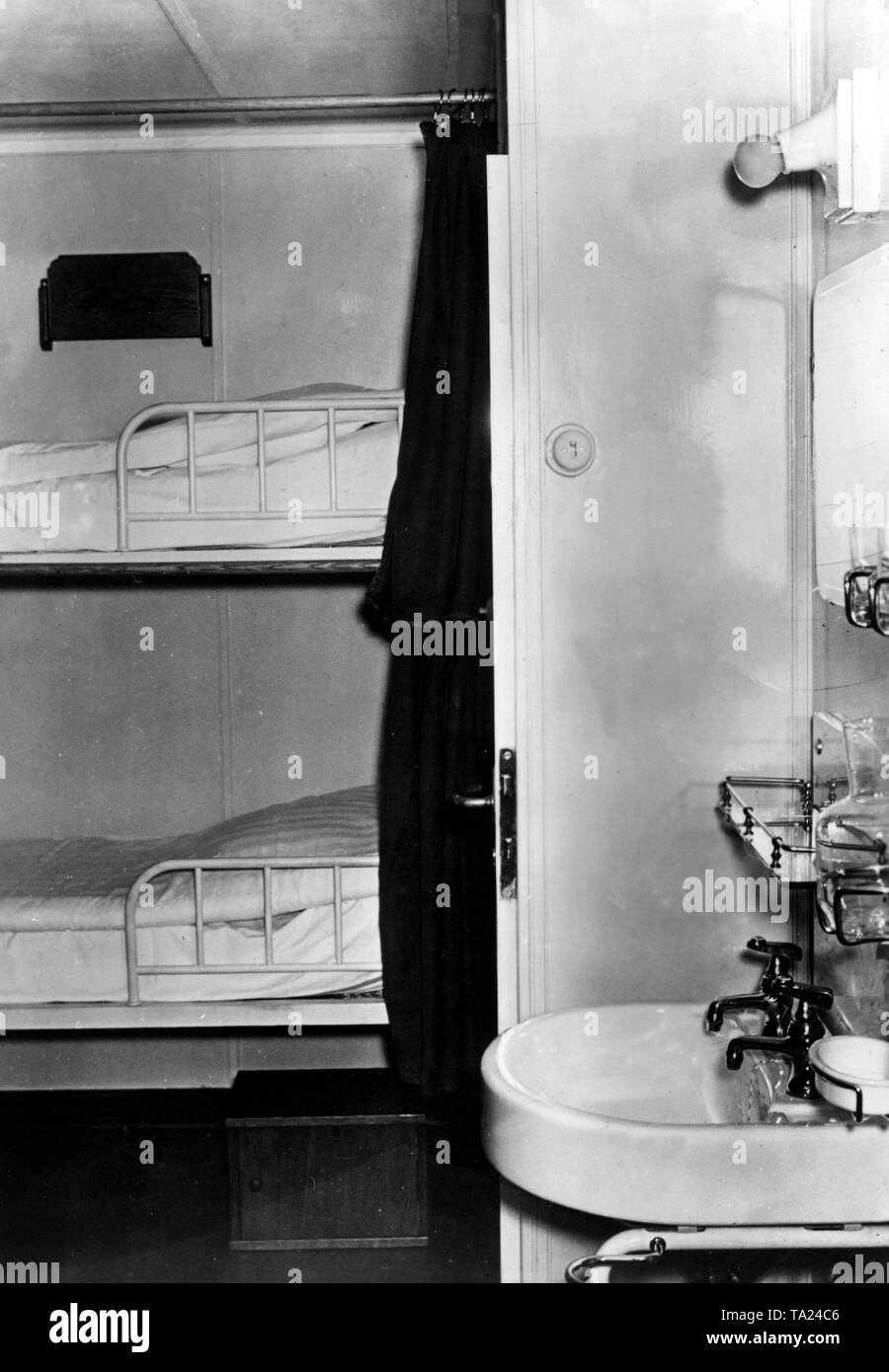 Model cabin of the newly built KdF ship 'Wilhelm Gustloff' before its launch in Hamburg. There are a total of 248 double-bed cabins (pictured) and 241 four-bed cabins. Stock Photo
