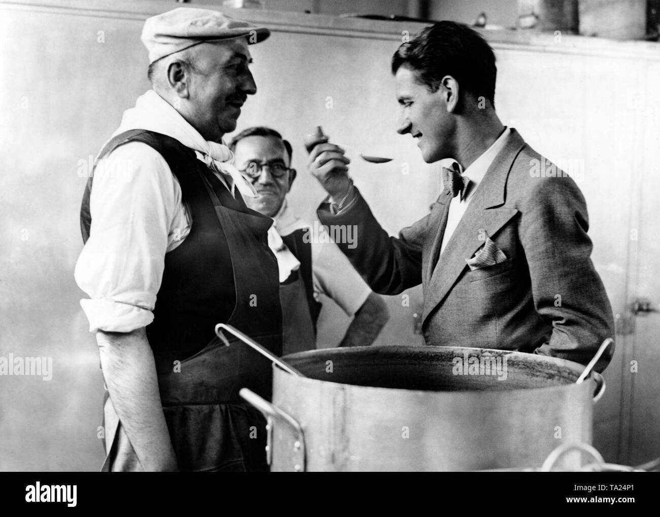 The Comite de la Jeunesse de France has set up an accommodation in Paris, which serves as a shelter for released young French prisoners of war. A young man eating. Stock Photo