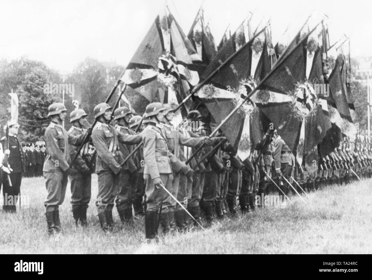 Members of the Kyffhaeuserbund gather at a parade on the Karlswiese. The soldiers in full uniform lowered the flags of the old regiments during the traditional lament 'Der gute Kamerad' ('The good Comrade') to honor the fallen. Stock Photo