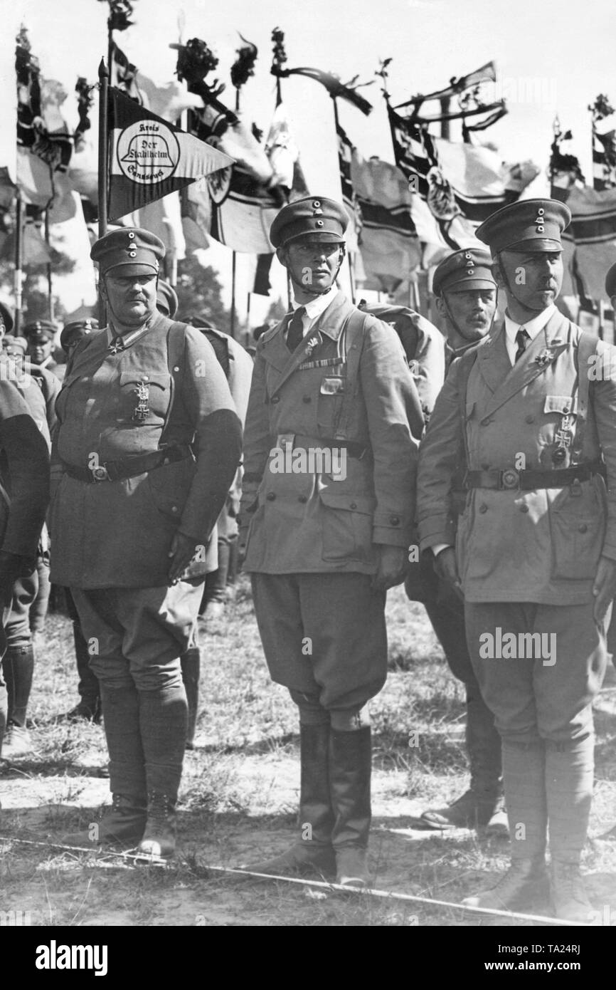 Close relatives of the last German emperor were members of the right conservative frontline soldiers’ organization Stahlhelm. Here, as representative of the Kreis Sanssouci at the Stahlhelm meeting in the Silesian Breslau, Prince Eitel Wilhelm (second son of the emperor), the eldest son of the Crown Prince and presumptive successor Prince Wilhelm, and another son of the Emperor, Prince Oskar von Prussia. In the background are several Reichskriegsflagge. Stock Photo