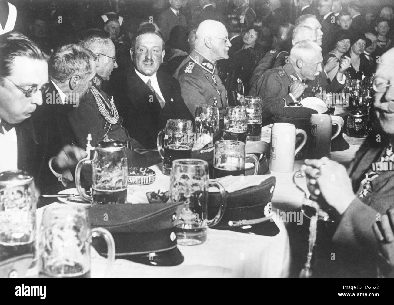Bavarian military and veterans' associations organized a commemoration for the 6th Army, with the speech of General Feeser in the center of the event. Here, the table of generals, with General Friedrichfranz Feeser (3rd from left to right), and, beside the man in civilian clothing, Prince Alfons of Bavaria and Crown Prince Rupprecht of Bavaria (bending). Stock Photo