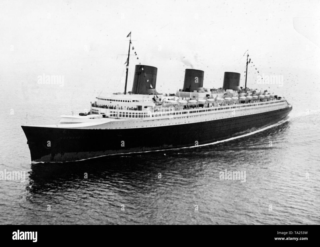 The French passenger ship 'Normandie' on her maiden voyage from Le Havre to New York. The 'Normandie' won in both directions the Blue Ribbon for the fastest Atlantic crossing. Stock Photo