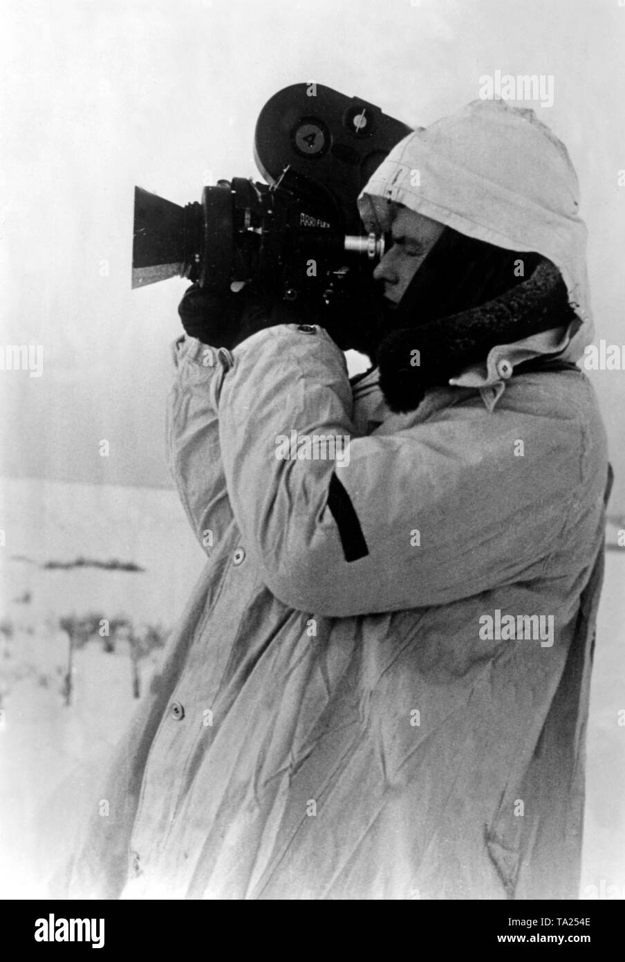 War correspondent films in the snow on the Eastern Front. Stock Photo