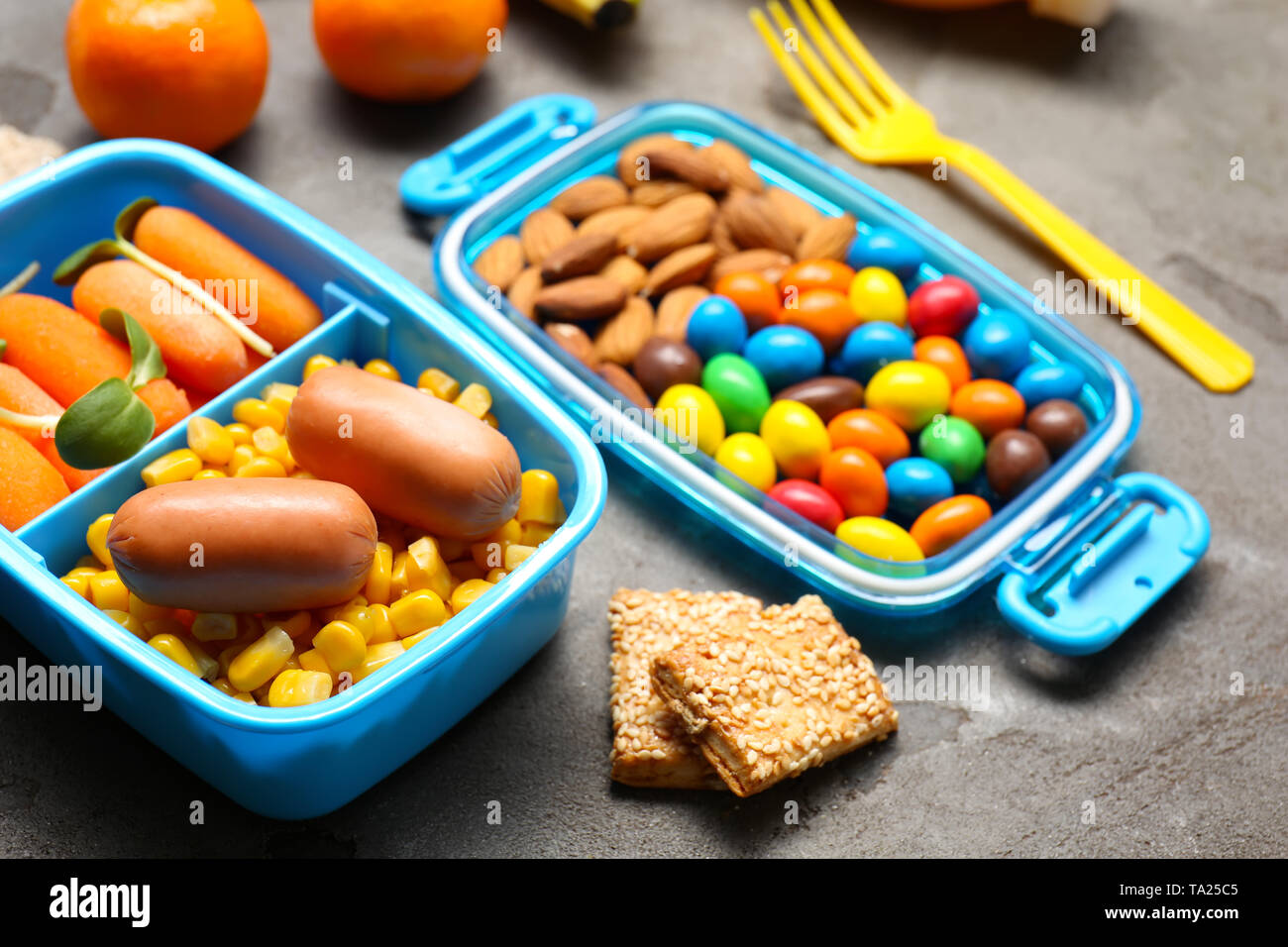 Lunch box with tasty food for kid on grey background Stock Photo