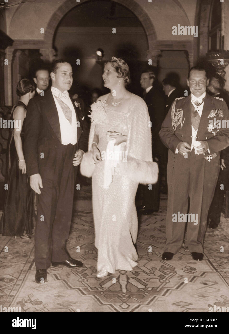 Hermann Goering (right) and his wife Emmy Goering are invited to a reception at the Italian embassy. Emmy Goering is talking to the host, Italian Ambassador Gian Galeazzo Ciano (left). Stock Photo