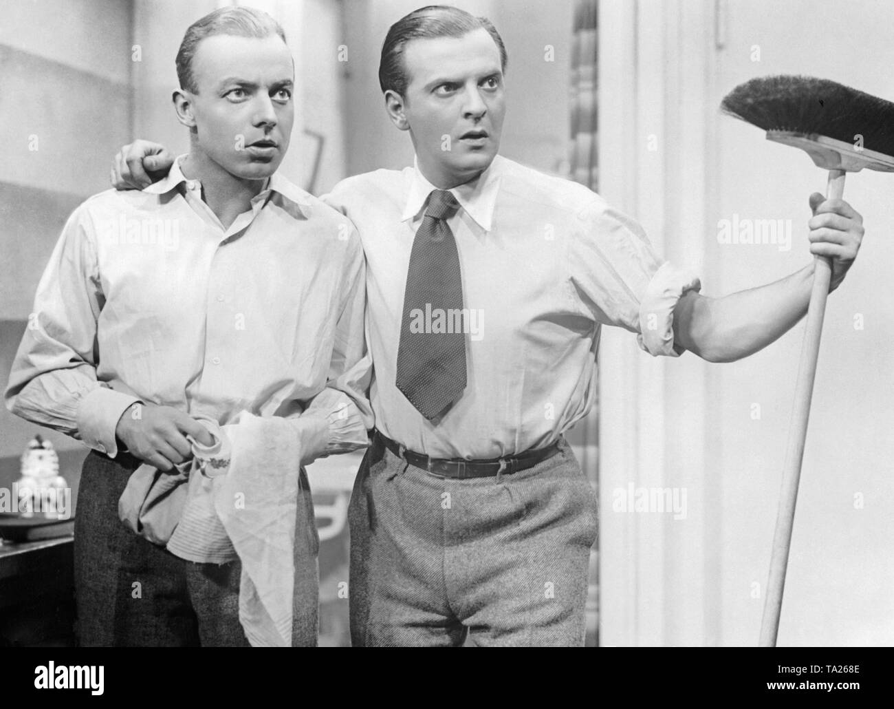 Heinz Ruehmann as Fred Holmes and Ernst Verebes as Willi Bertram in the feature film 'Things Are Getting Better Already' by Kurt Gerron. This movie has disappeared. Stock Photo