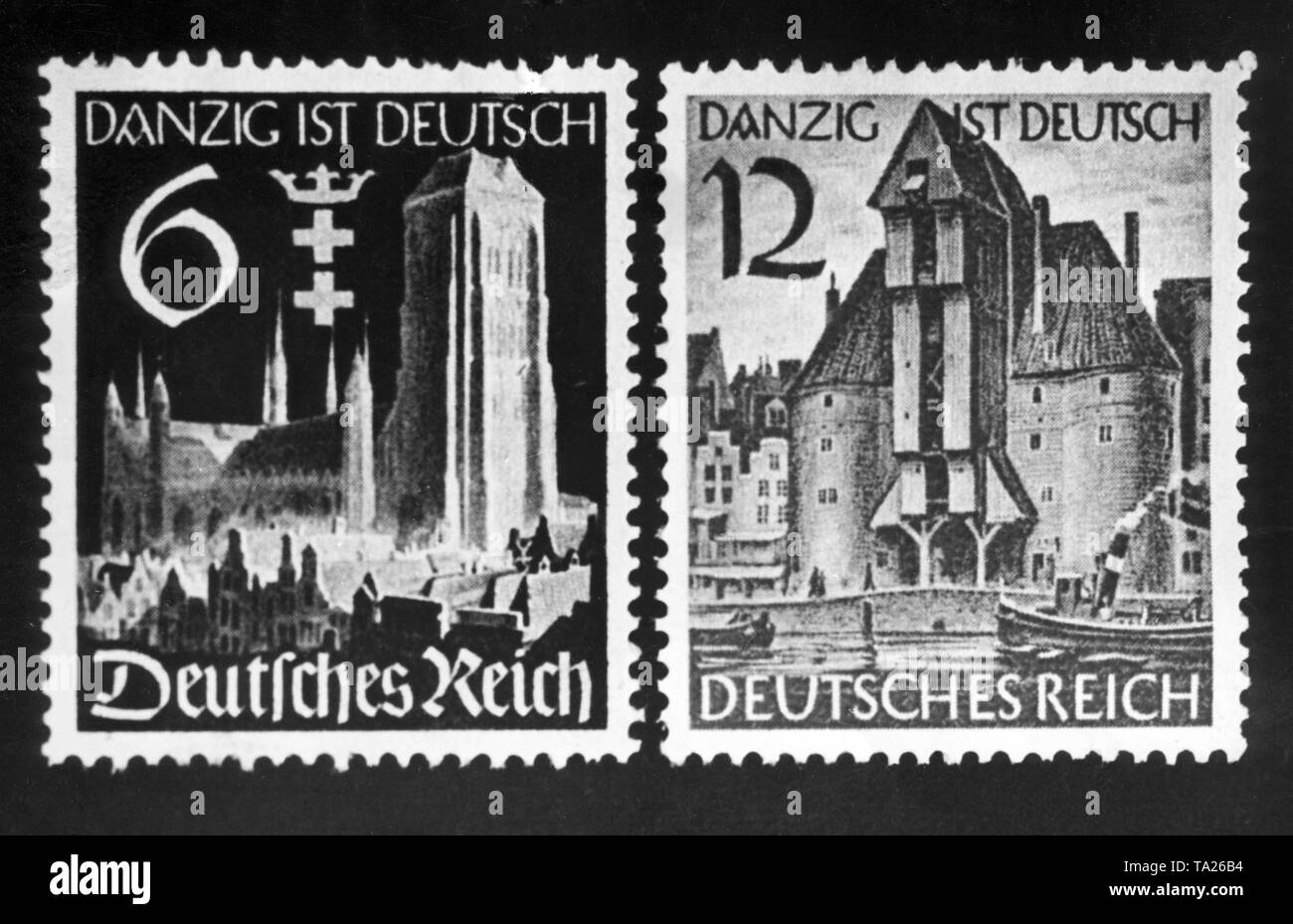 After the unlawful annexation of Gdansk to the German Reich, the Deutsche Reichspost (German Post) issued special stamps for 6 and 12 Reichspfennig at all post offices and offices. On the left stamp, the St. Mary's Church. On the right, the Crane of Gdansk and the inscription 'Gdansk is German. German Empire '. Stock Photo