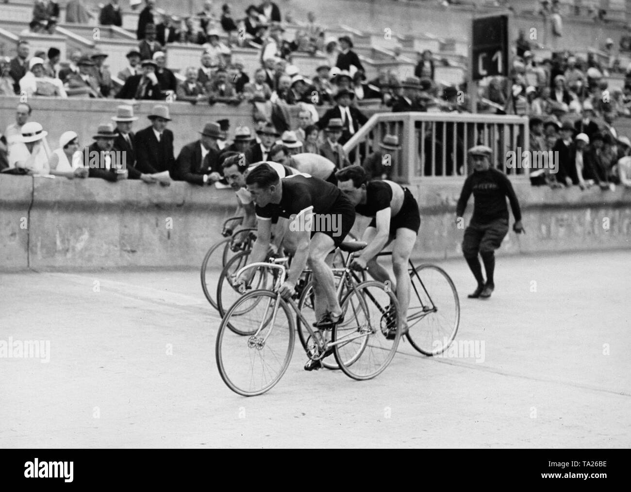 Four track cyclists in a race at Grunewaldstadion on July 24, 1932, as part of the Arcona Prize. Stock Photo