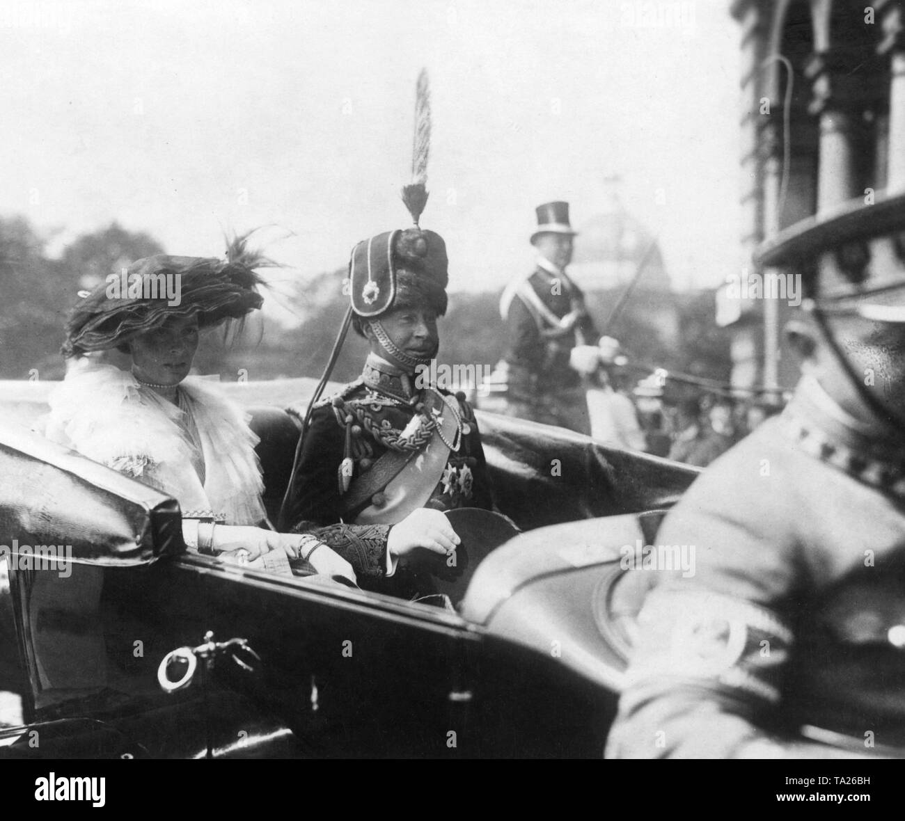 Crown Princess Cecilie and her husband Crown Prince Wilhelm of Prussia travel in a carriage through Berlin. The photo was taken as part of the wedding ceremony of the sister of the Crown Prince, Princess Viktoria Luise of Prussia, with Prince Ernst August of Hanover. Stock Photo