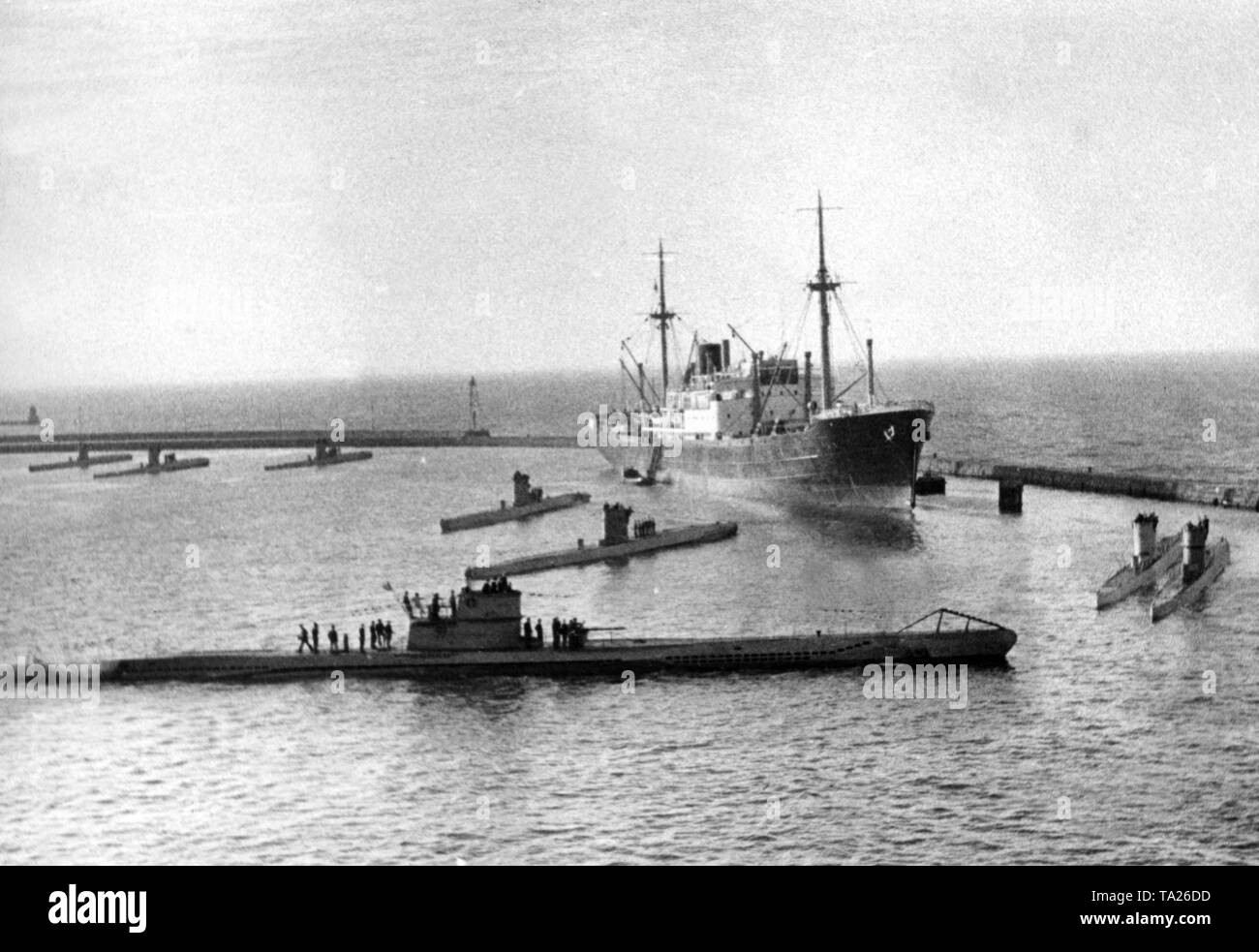 U-boats of the German Kriegsmarine. In the foreground a boat of the type VIIC, behind it smaller submarines. Stock Photo