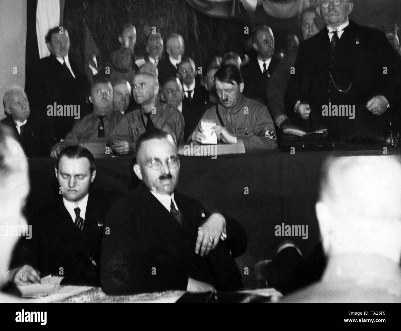 Wilhelm Frick, Adolf Hitler and Alfred Hugenberg (center, from left to right) at the founding event of the Harzburg Front. Stock Photo