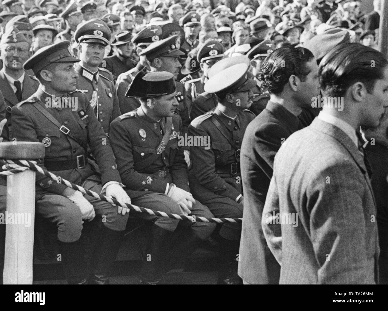 Photo of Spanish and German officers on a grandstand on the occasion of the celebrations of the return of the Condor Legion after the Spanish national victory in the Spanish Civil War in Hamburg on 31 May, 1939. In the first row, Spanish officers of the army and an officer (black hat) of the Guardia Civil of a paramilitary police unit. In the background, officers of the Wehrmacht. Among the Spanish honorary guests there was also a high-ranking general: Antonio Aranda Mata. Stock Photo