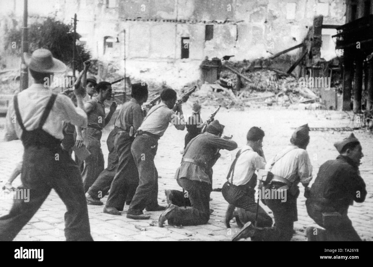 Photo of a group of Republican fighters during the siege of the Alcazar of Toledo in the summer of 1936. The armed soldiers wear civilian clothes or uniforms. Stock Photo
