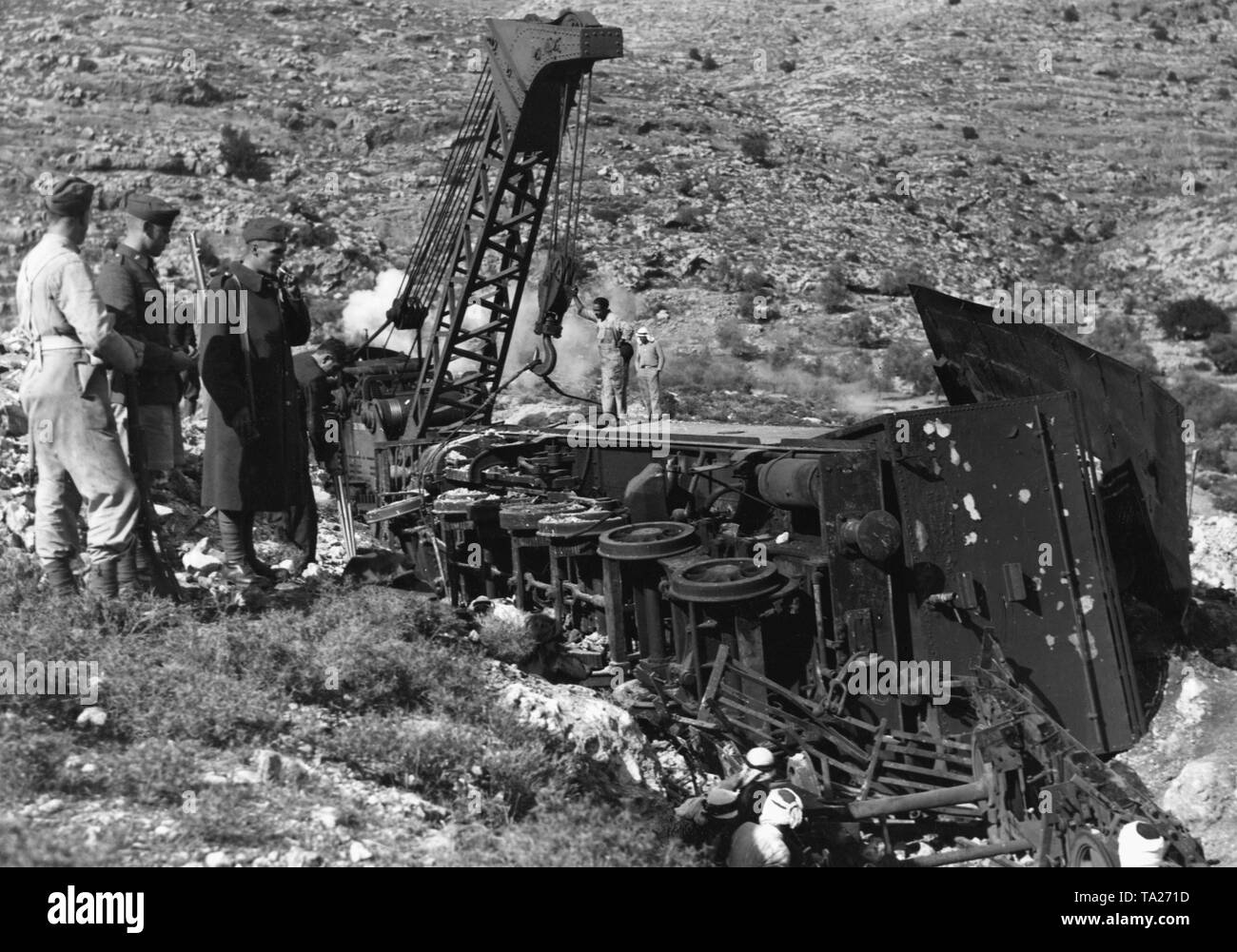 The locomotive of a train of the British Army, which had been derailed by an Arab attack. Stock Photo