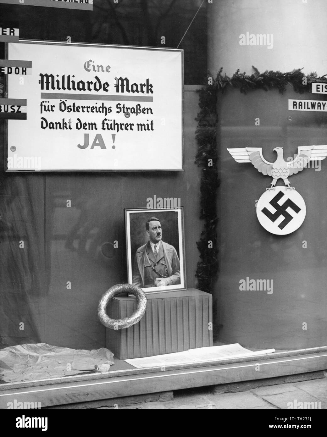 In Austria, is held a referendum on the annexation of Austria to the German Reich. In a Viennese shop window hangs an election poster for the plebiscite. It reads: 'One billion marks for Austria's roads / Thank to the Fuehrer with YES!'. Below is a portrait of Adolf Hitler. Stock Photo