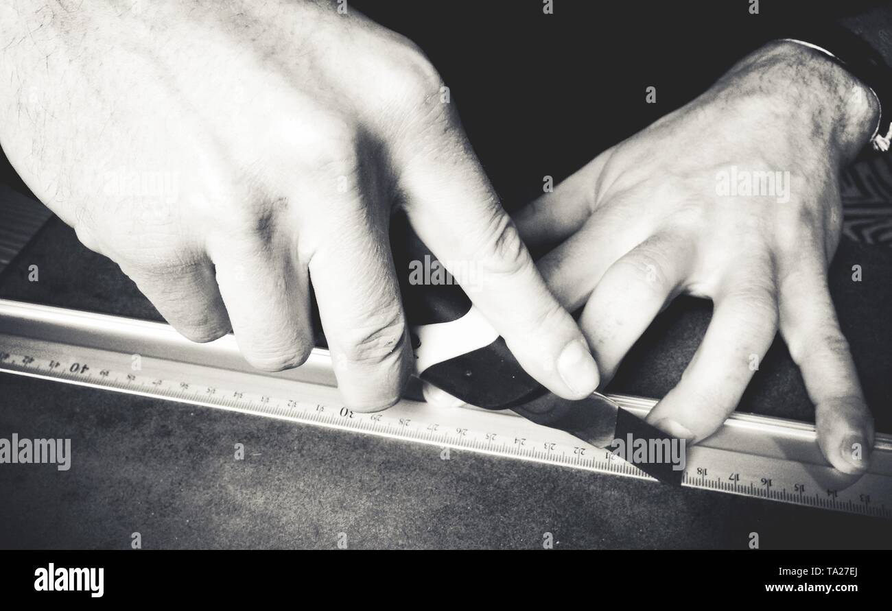 Close up of female hand measuring construction project with ruler hi ...