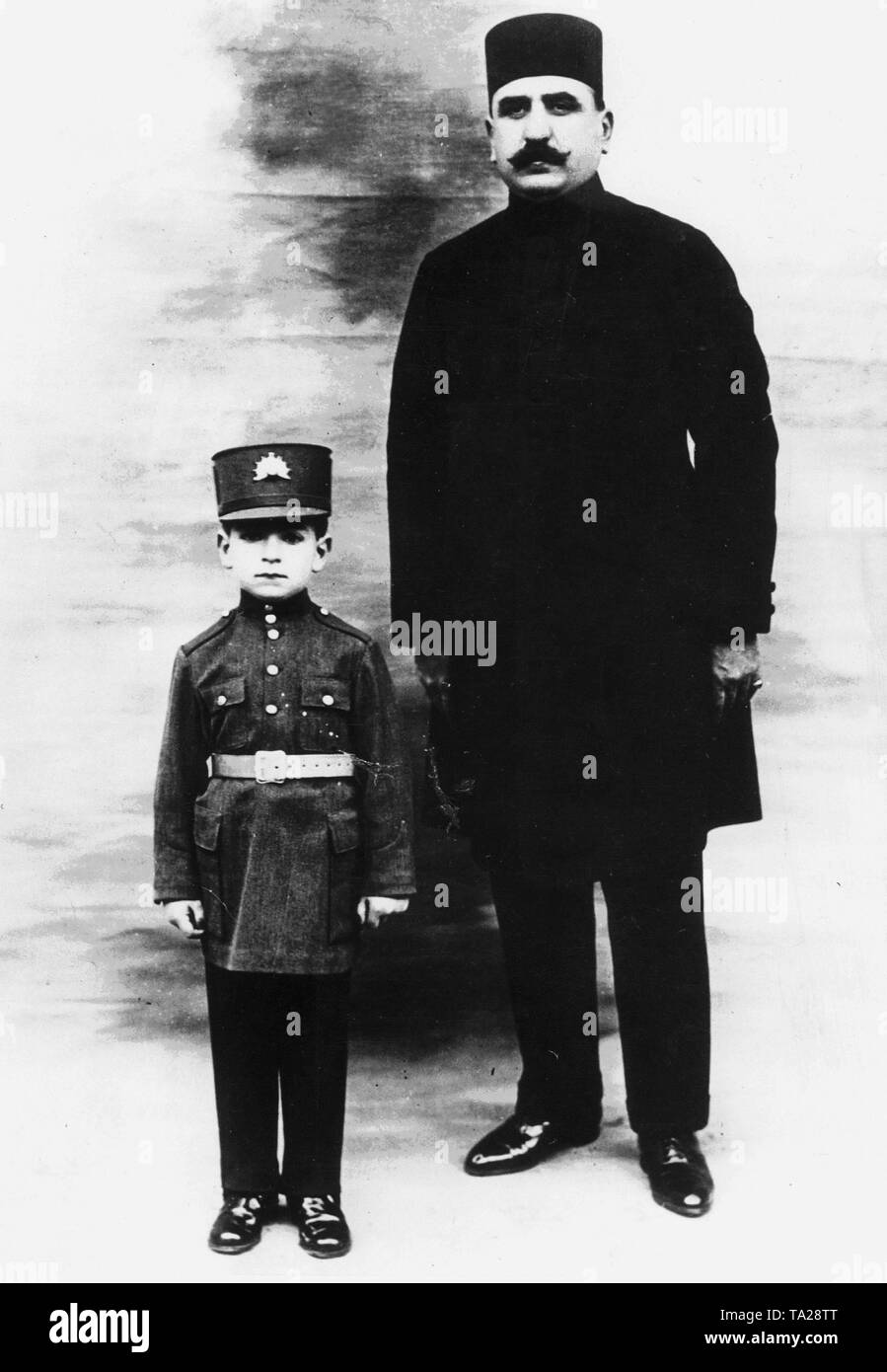The Crown Prince Mohammad Reza Pahlavi as a seven year old boy with his uncle Amir Akram, who was also responsible for his personal safety. Stock Photo