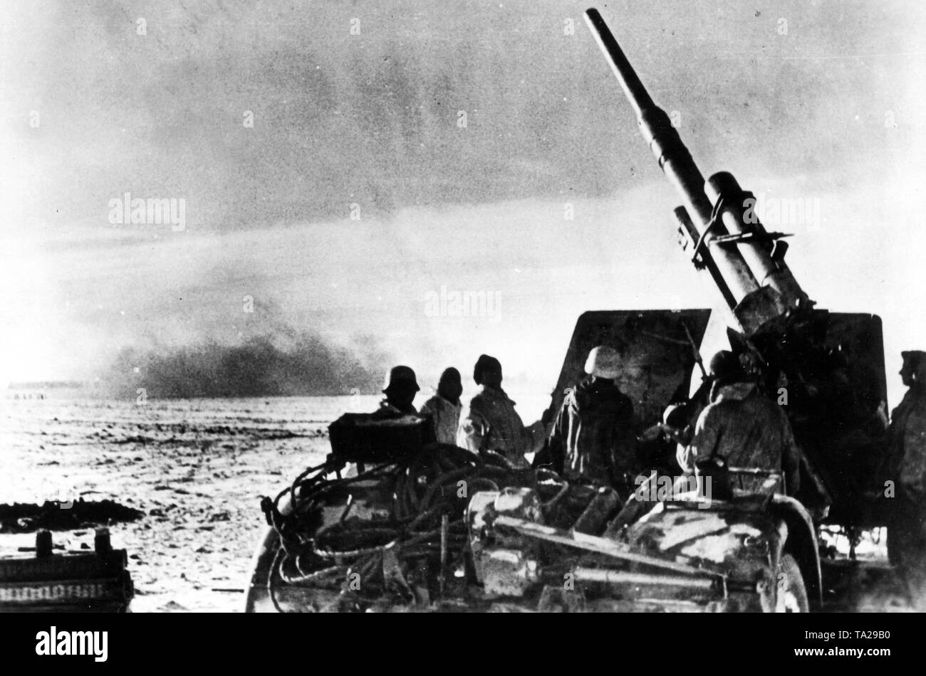 The photo shows an 8.8 cm Flak 41, a heavy anti-aircraft gun in the fight against Russian combat airplanes that attack refugee convoys and supply columns. Stock Photo