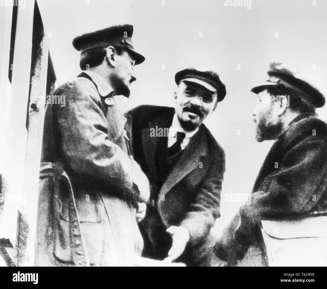 From left: Leon Trotsky, Vladimir Ilyich Lenin and Lev Kamenev in conversation during the Congress in Petrograd, which led to the formation of the Third Communist International (Comintern). Stock Photo