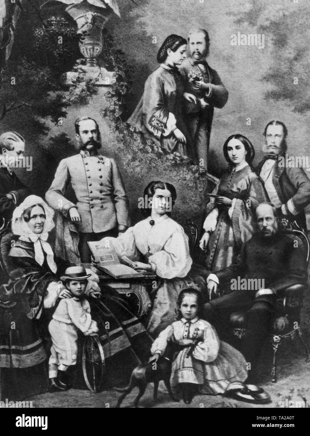 The members of the Imperial Family of Austria (Elisabeth sitting in the middle, Franz Joseph standing behind her). Stock Photo