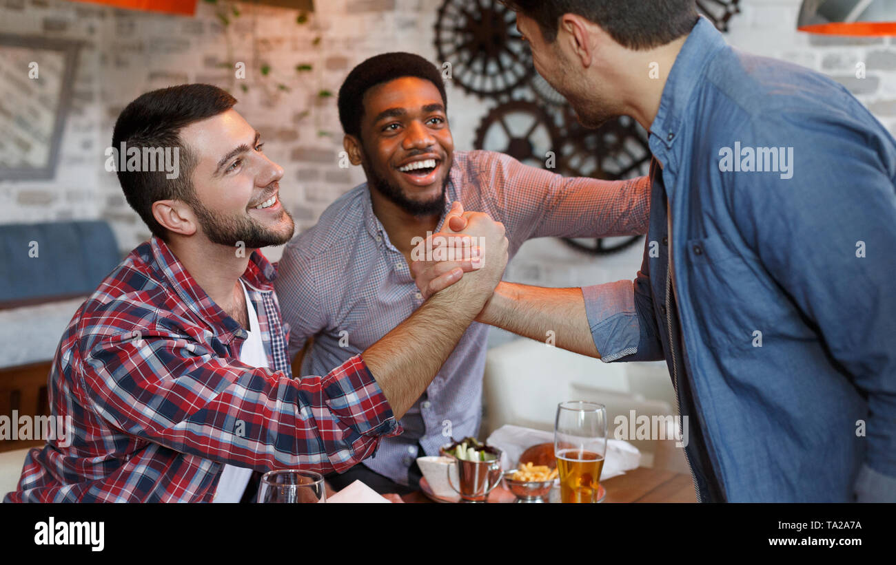 Old Friends Meeting. Mates Meet In Beer Pub Stock Photo