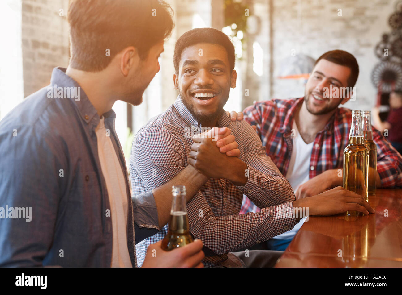 Old Friends Meeting. Mates Greeting Each Other Stock Photo