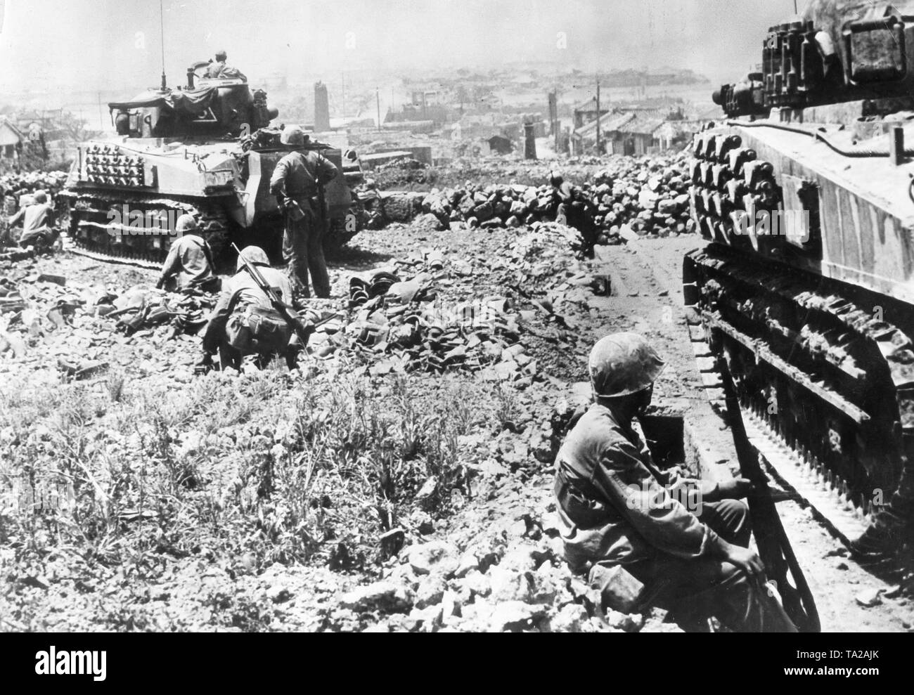 American soldiers with Sherman tanks before the capital of Okinawa, Naha, 1945 Stock Photo