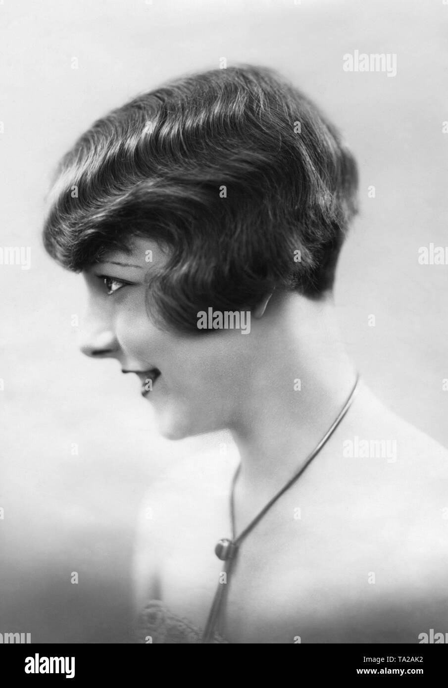 Woman with a short haircut. Undated photo. Stock Photo