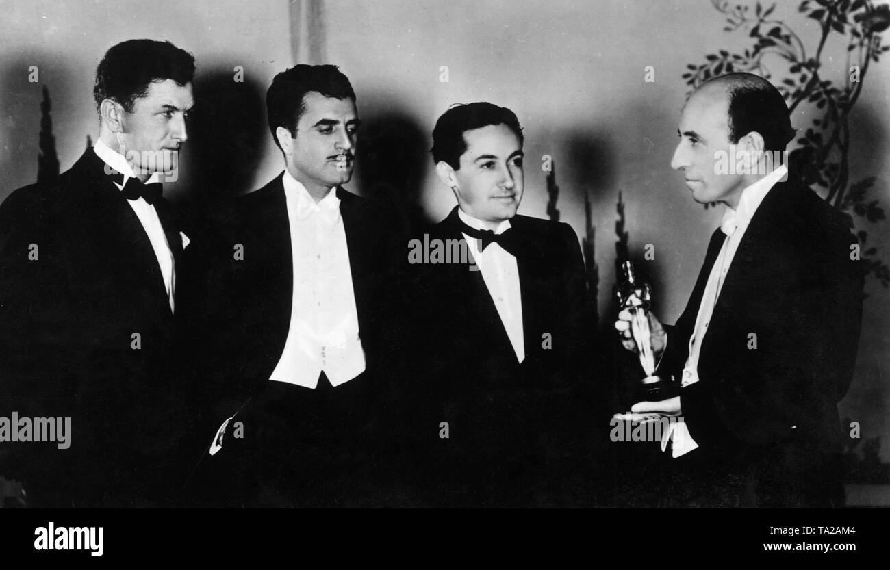 Oscar winners of the year 1927/1928 (from left to right): Cinematographer Clyde de Vinna recognized for his camera work in the film White Shadows in the South Seas (1928), Cedric Gibbons, who created the design and costume design for The Bridge of San Luis Rey, Irving Thalberg, production manager of the film studio Metro-Goldwyn-Mayer, whose movie Broadway Melody won best film and Academy President William B. de Mille Stock Photo