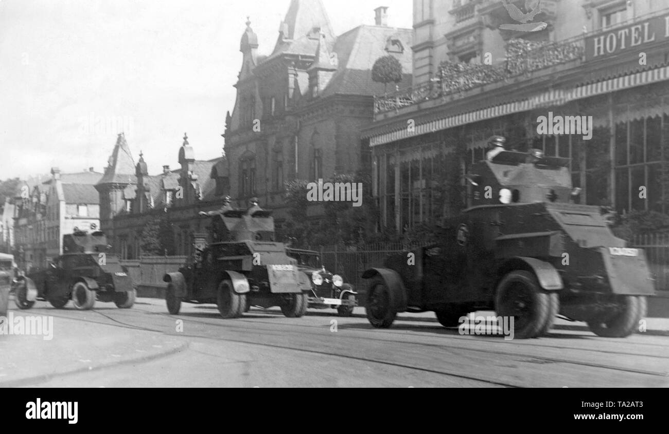 These armored vehicles were the last unit of troops of the French occupation army, which left the occupied Rhineland. Here the vehicles are on their farewell trip in Trier. Stock Photo