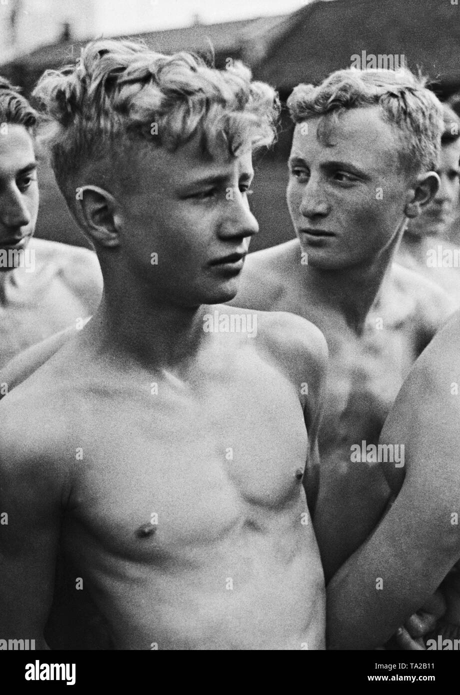 A group of shirtless Hitler Youth boys are lined up for sport Stock ...