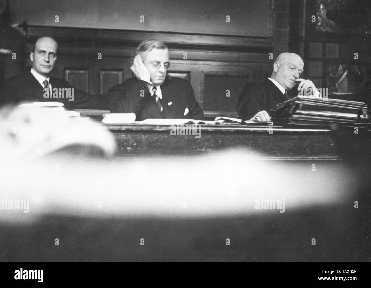 After the publication of an article the editor of Stahlhelm-Zeitung, Kleiner (left), as well as the Bundesfuehrer (leaders) Franz Seldte and Theodor Duesterberg, are being prosecuted for insults and offenses against the Republican Protection Act and sentenced to a fine. Stock Photo
